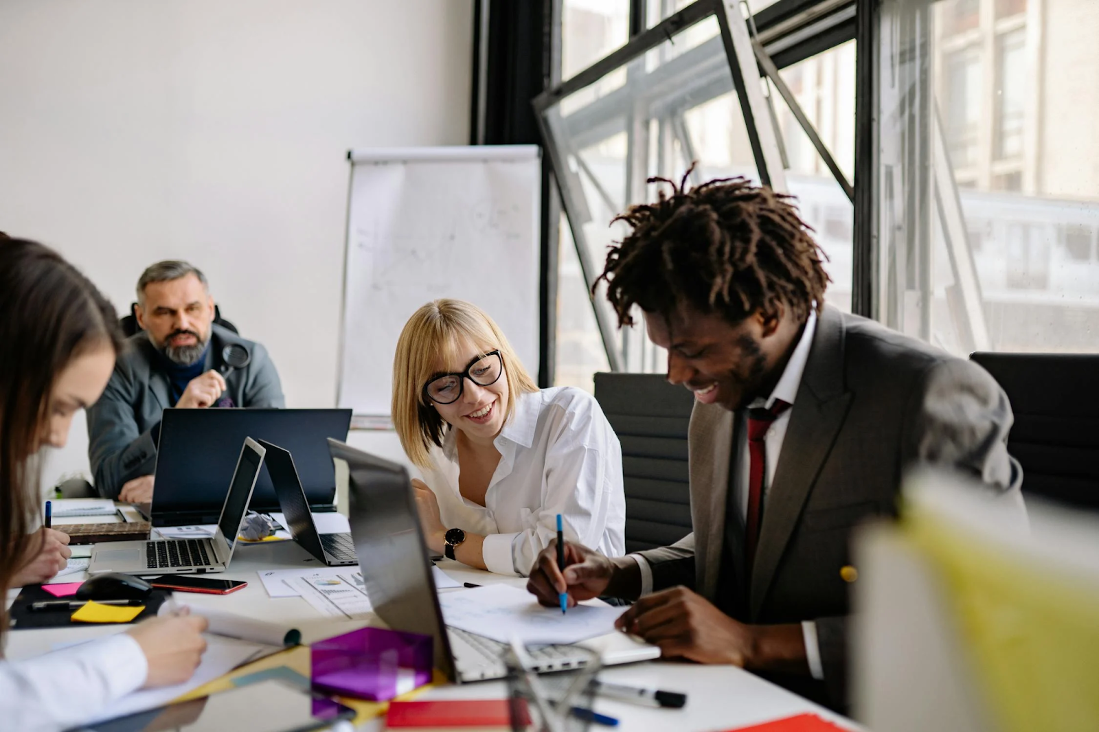 A man and woman work on a corporate DEI training together