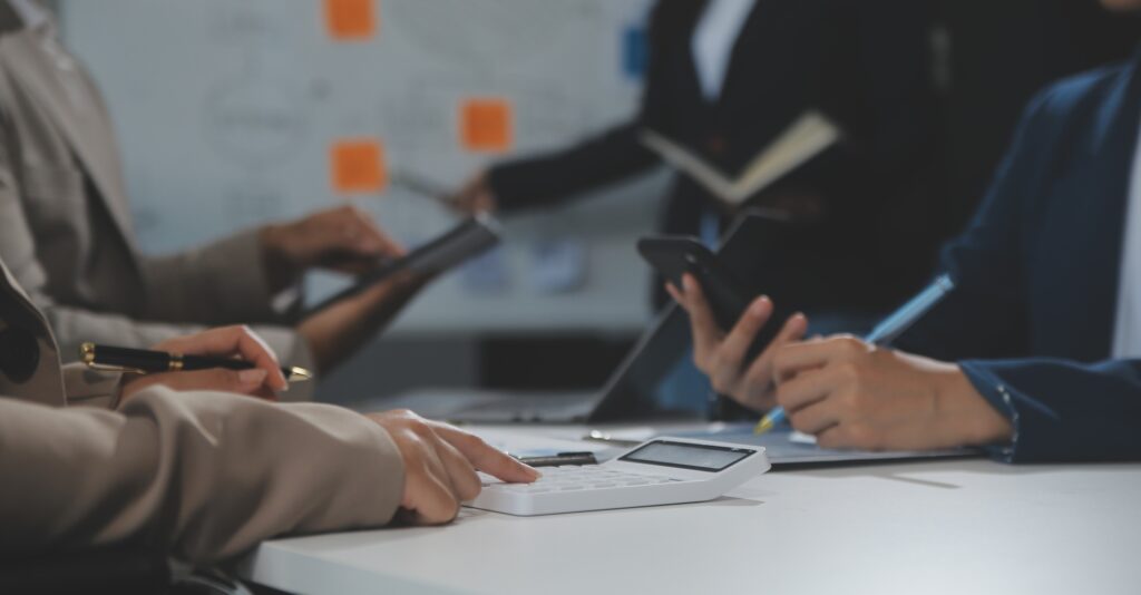 HR professionals analyzing financial and marketing data during a collaborative meeting