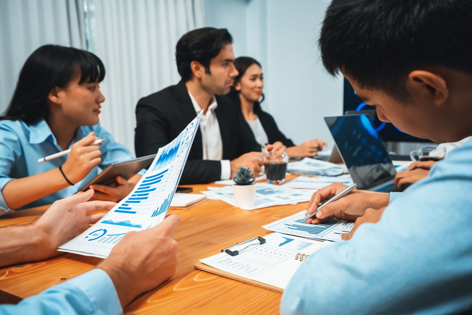 An HR Professional with a seat at the table in a business meeting